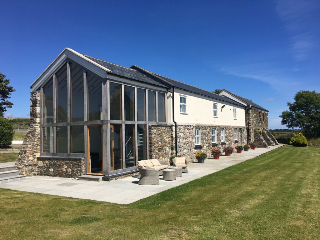 Stone farm stay accommodation in the Isle of Man countryside with garden and patio